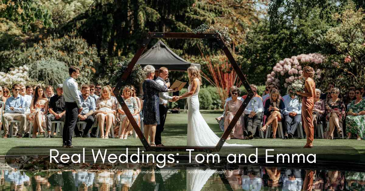Wedding at Trotts Garden in Ashburton. Gorgeous wedding couple with their marriage celebrant and their guests. The picturesque setting featured a stunning wooden geometric arch by a serene pond, making for a gorgeous ceremony backdrop. The label says, 
