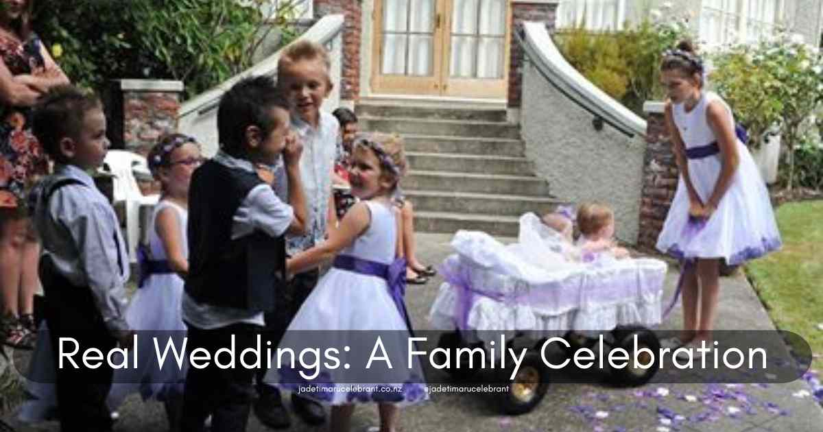 A purple-themed wedding with two babies in carriages, flower girls, and bridesmaids all in white dresses with purple bows. The ring bearers have black pants, white shirts and black vests. The label says 