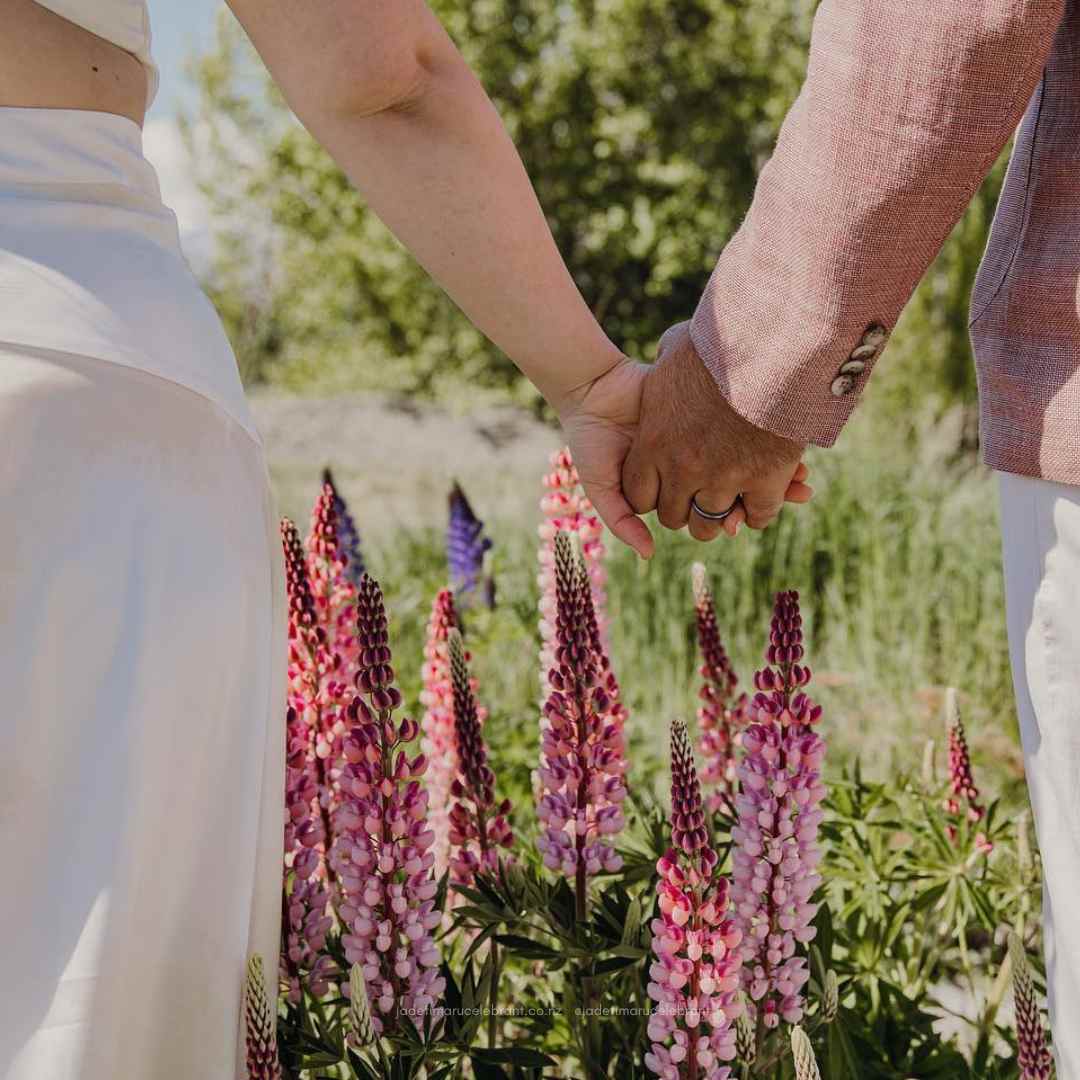 Get married in the Lupins at Lake Tekapo with Jade Whaley Marriage Celebrant NZ wedding and elopement packages.